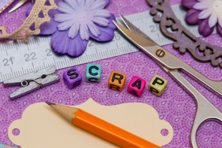 scrapbook supplies on purple background