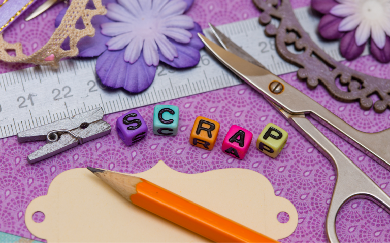 scrapbook supplies on purple background